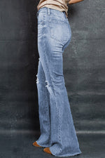 Load image into Gallery viewer, Distressed Raw Hem Flare Jeans
